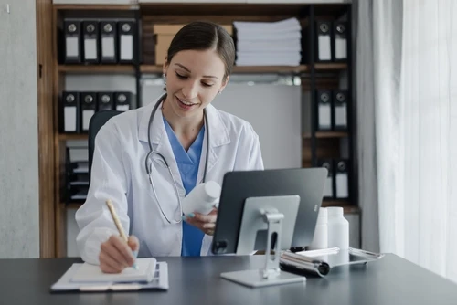 medical worker writing on a paper