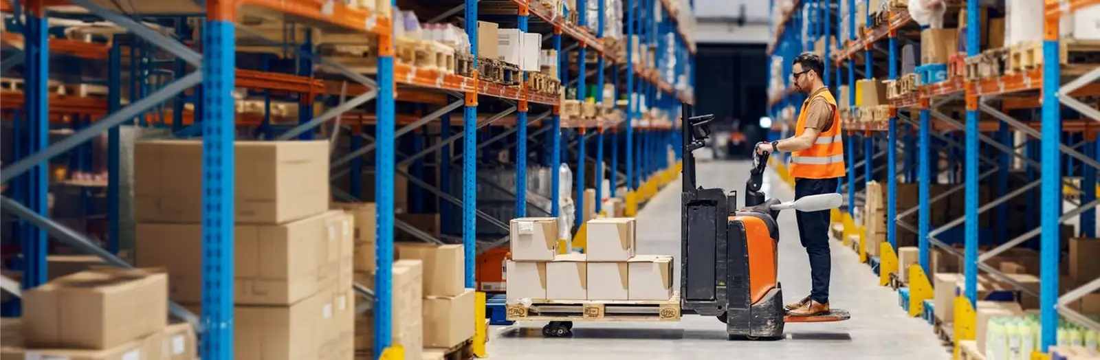 man on a forklift in the warehouse